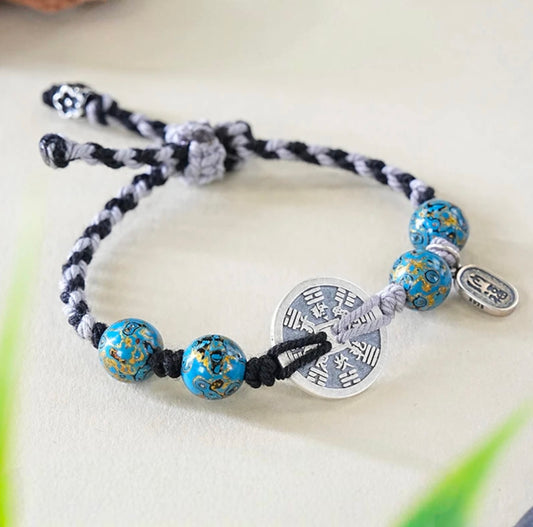 Pulsera de auspicio con dije azul